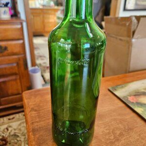 green glass John Jameson irish wiskey bottle embosses signatures around bottle